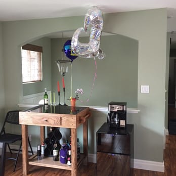 L E Baca Construction - a table with balloons and wine bottles - General Contractors Near Me - Newark, California