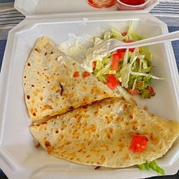 Steak Quesadilla w/ lettuce, tomorrow and sour cream. Steak Quesadilla w/ lettuce, tomorrow and sour cream.