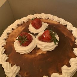 a chocolate cake with strawberries on top
