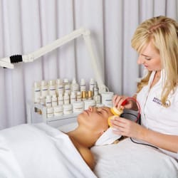 BA Skin Lab - owner/operator Barbara Aquino administering BR's exclusive non-surgical (microelectronic) face lift on client...