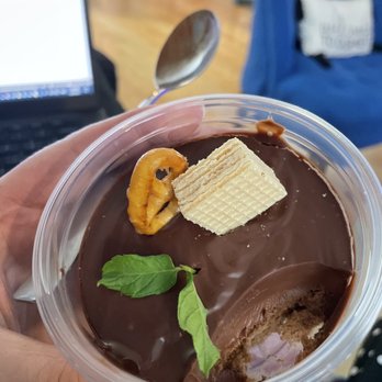 Meii Tea - a hand holding a chocolate dessert - Bakeries Near Me - Springfield, Illinois Meii Tea - a hand holding a chocolate dessert - Bakeries Near Me - Springfield, Illinois