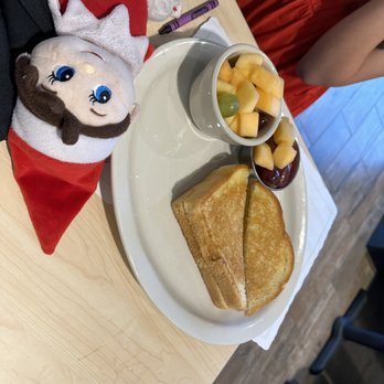The Toasted Yolk Cafe - Kids grilled cheese with a side of fruit - they failed to tell me it already came with a "garnish" of fruit. - Breakfast & Brunch Near Me - Germantown, Tennessee