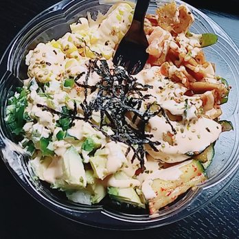 Kimchipapi Kitchen - Salmon poke bowl with kimchi cucumbers, jalapeños, corn, avocado, fish cake, nori, and Wasabi furikake. Delish. - Korean Near Me - Allston, Massachusetts