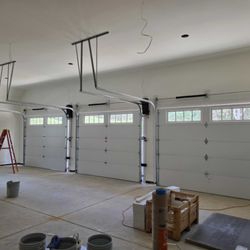 Mullis Garage Doors - Three 10x8 Model 3630 insulated Carriage House garage doors with Chamberlain 8500-W wall-mounted opener installed in Kannapol...