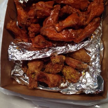 Atlanta's Best Wings - Medium regular on top and lemon pepper wings on the bottom. - Chicken Wings Near Me - Decatur, Georgia Atlanta's Best Wings - Medium regular on top and lemon pepper wings on the bottom. - Chicken Wings Near Me - Decatur, Georgia