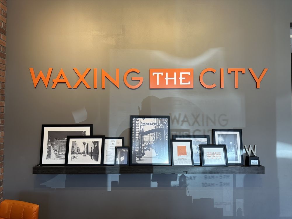 Waxing The City Logo