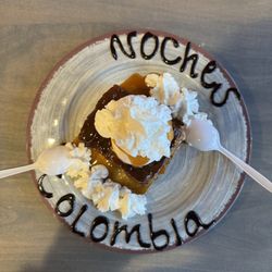 Noches de Colombia - My warm bread pudding with whipped cream topped vanilla bean cream