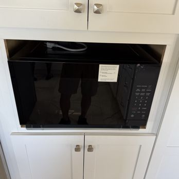Installationpro - Before: new microwave sitting in oversized opening - Handyman Near Me - Irvine, California Installationpro - Before: new microwave sitting in oversized opening - Handyman Near Me - Irvine, California