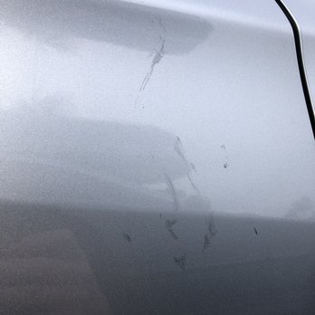 Caliber Collision - Silver paint hand print smear - Body Shops Near Me - Long Beach, California