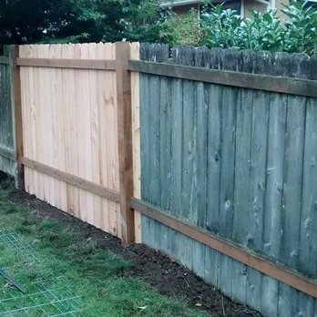 Lawn and Order - a fence in a backyard - Landscaping Near Me Lawn and Order - a fence in a backyard - Landscaping Near Me