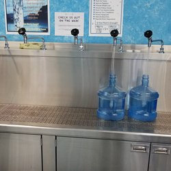 Lakeside Pure Water Store -Roseland - Self service. Getting a couple of 2 gallon water bottles filled.