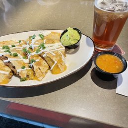 This amazing barbacoa quesadilla and Twisted Tea on tap. Mi favorito