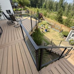 Planet Builders - Timbertech, along with cable railing, done by planet builder llc.