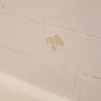 Evolving Bathtub & Cabinet Refinishing  - Peeling on the tile - General Contractors Near Me