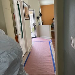 Dry Right Flood - Floor covering leading from doorway to stairs.
