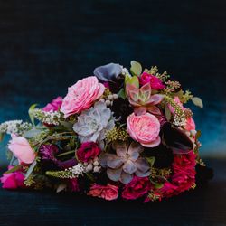 Bergeron's Flowers - Vibrant Bergerons' bridal bouquet full of textures, succulents, and jewel-toned blooms! Photo: https://www.kenpak.com/