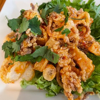Boda - Calamari with spicy/sweet sauce drizzled on top - Thai Near Me - Portland, Maine Boda - Calamari with spicy/sweet sauce drizzled on top - Thai Near Me - Portland, Maine