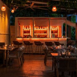 Outdoor restaurant patio seating in midtown miami ziva mediterranean at night