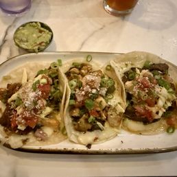 One of each: chicken, pork, carne asada taco