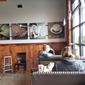 Woods Coffee - Right side view from front entrance of coffee shop. Table booth seating with plugin outlets and high top tables - Coffee & Tea Near Me - Mount Vernon, Washington