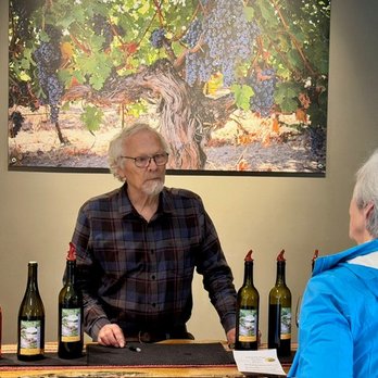Rolling Bay Winery - Alphonse behind the tasting bar - Wineries Near Me - Bainbridge Island, Washington Rolling Bay Winery - Alphonse behind the tasting bar - Wineries Near Me - Bainbridge Island, Washington