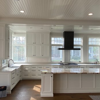 Skyline Builders - a kitchen with white cabinets and a large island - General Contractors Near Me - Warsaw, Indiana