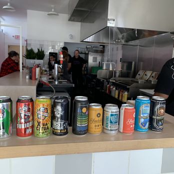 All Square - Some beverages on display, cooks in the background. - American Near Me - Minneapolis, Minnesota