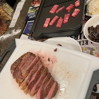 Alexander's Prime Meats and Catering - Tomahawk steak on cutting board and slowly grilling wagyu filet mignon - Meat Shops Near Me - San Gabriel, California Alexander's Prime Meats and Catering - Tomahawk steak on cutting board and slowly grilling wagyu filet mignon - Meat Shops Near Me - San Gabriel, California