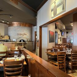 Le Vieux Four - Pizza oven and seating area.