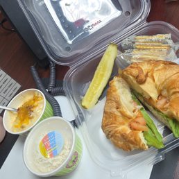 Sassy Scotty with lettuce and tomato on a Croissant. A free scoop of the Classic Carol, cup of Loaded Potato Soup, pickle & crackers