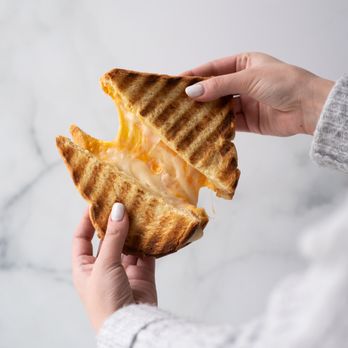Jugo Juice - a person holding a grilled cheese sandwich - Juice Bars & Smoothies Near Me - Surrey, British Columbia Jugo Juice - a person holding a grilled cheese sandwich - Juice Bars & Smoothies Near Me - Surrey, British Columbia