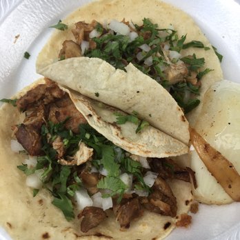 Don Beto El Poblano - Two carnitas tacos and a bottled water for $5. - Food Trucks Near Me - Raleigh, North Carolina Don Beto El Poblano - Two carnitas tacos and a bottled water for $5. - Food Trucks Near Me - Raleigh, North Carolina