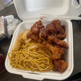 a takeout box of chinese food a takeout box of chinese food
