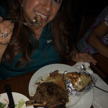 Friendly Inn Bar - a woman eating a meal - Beer Bar Near Me - Houston, Texas Friendly Inn Bar - a woman eating a meal - Beer Bar Near Me - Houston, Texas