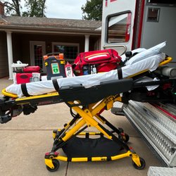 Papio Transport Service - Power operated stretcher with various BLS support equipment