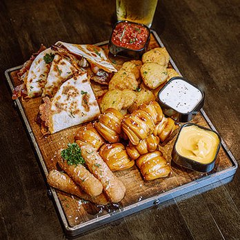 Lucky's - a platter of food on a wooden table - Lounges Near Me - Las Vegas, Nevada Lucky's - a platter of food on a wooden table - Lounges Near Me - Las Vegas, Nevada
