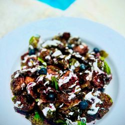 Cleveland Country Club - Crispy brussels sprouts with blueberry glaze and a Housemade white sauce.