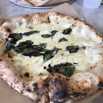 Pieous - (I moved most of the basil leaves to one slice) - Pizza Near Me - Austin, Texas Pieous - (I moved most of the basil leaves to one slice) - Pizza Near Me - Austin, Texas