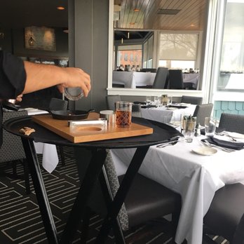 Chart House - Waiter creating the Torched Manhattan. - Seafood Near Me - Alexandria, Virginia