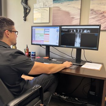 Restore Chiropractic - Going over my x-rays (taken at an imaging center nearby) with Dr. Weich. Wow, I was blown away at how misaligned everything was. - Chiropractors Near Me - Las Vegas, Nevada