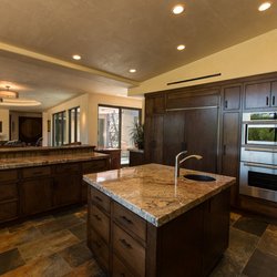 Heredia's Custom Cabinets - Custom cabinets with matching refrigerator face.