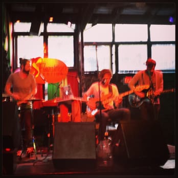 Flamingo Cantina - a group of people playing instruments - Bars Near Me - Austin, Texas