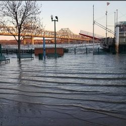 East Peoria River Front Park - Water cresting and over taking the walkway and the seating area.
