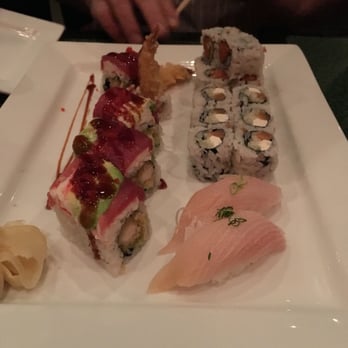 O Sushi - O Sushi Roll (left), Philadelphia Roll (right rear), Yellow Tail (right front). - Sushi Bars Near Me - North Kingstown, Rhode Island O Sushi - O Sushi Roll (left), Philadelphia Roll (right rear), Yellow Tail (right front). - Sushi Bars Near Me - North Kingstown, Rhode Island