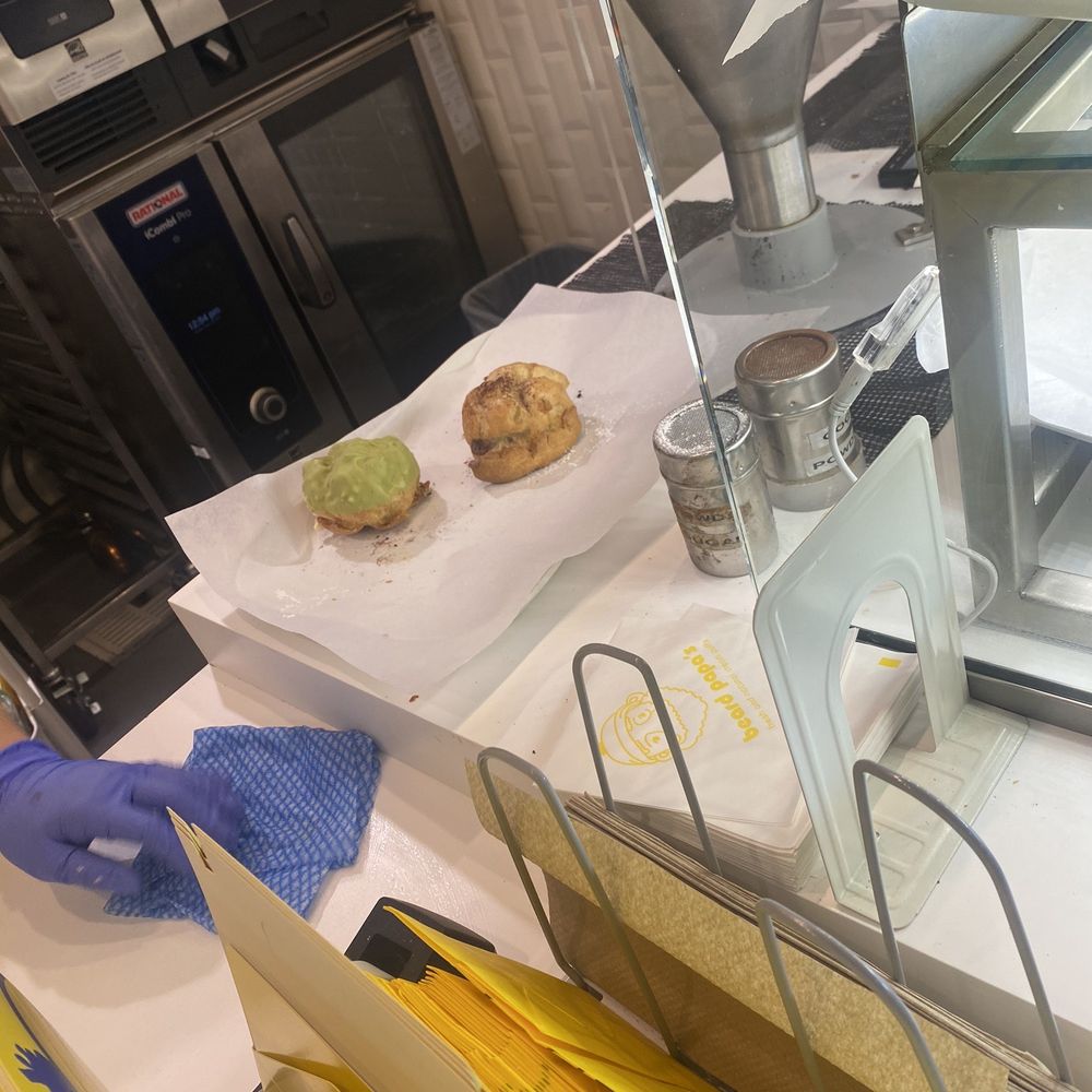 Beard Papa's Castro Valley - Cream puffs about to be filled by dispensing unit. - Desserts Near Me - Castro Valley, California Beard Papa's Castro Valley - Cream puffs about to be filled by dispensing unit. - Desserts Near Me - Castro Valley, California