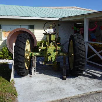 Dooley Groves - an old tractor in front of a house - Fruits & Veggies Near Me - Ruskin, Florida Dooley Groves - an old tractor in front of a house - Fruits & Veggies Near Me - Ruskin, Florida