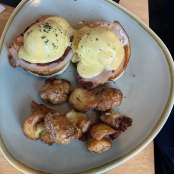 Sylvia's Restaurant and Lounge - Eggs Benedict with bacon and potatoes - Canadian (New) Near Me - Vancouver, British Columbia Sylvia's Restaurant and Lounge - Eggs Benedict with bacon and potatoes - Canadian (New) Near Me - Vancouver, British Columbia