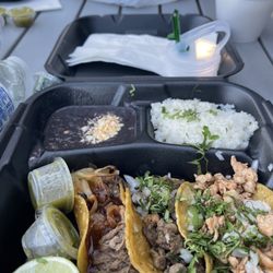 This is the taco dinner plate that includes black beans,white rice, with a little cilantro on top.