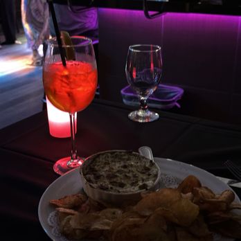 The Nest - Aperol spritz & artichoke dip with chips - Bars Near Me - Indian Wells, California The Nest - Aperol spritz & artichoke dip with chips - Bars Near Me - Indian Wells, California