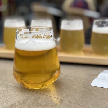 Collective Arts - a glass of beer on a table - Breweries Near Me - Toronto, Ontario Collective Arts - a glass of beer on a table - Breweries Near Me - Toronto, Ontario